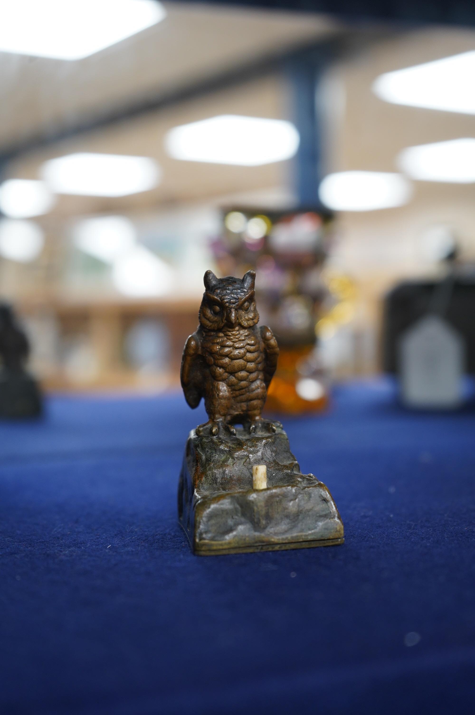 An Austrian cold painted bronze bellpush modelled as a perched owl, 7.5cm high. Condition - fair.